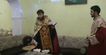 After Christmas, clergy perform a house blessing ceremony